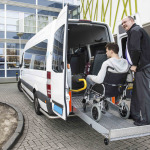 A driver helping the wheelchair user