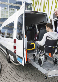 A driver helping the wheelchair user