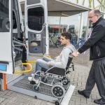 A driver helping the wheelchair user