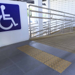 Accessibility sign with ramp