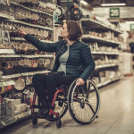 woman in wheelchair shopping at the supermarket