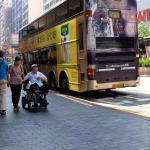 Old Man in Wheelchair with a woman in HK