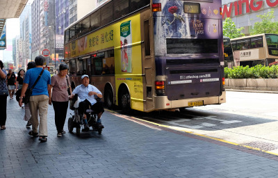 Old Man in Wheelchair with a woman in HK