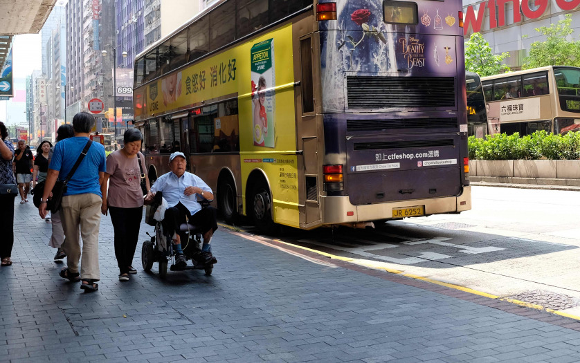 Old Man in Wheelchair with a woman in HK