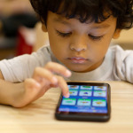 kid with disability using smartphone