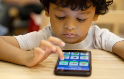 kid with disability using smartphone