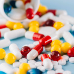 Colorful pills and plastic bottle