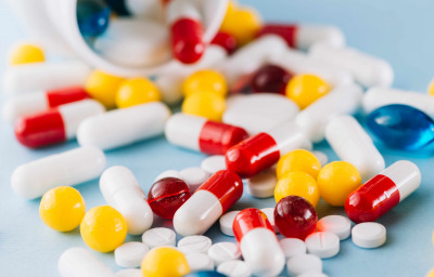 Colorful pills and plastic bottle