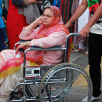Pakistani woman in wheelchair during a rally