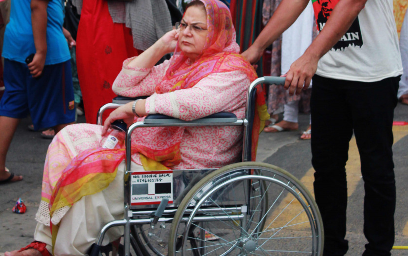 Pakistani woman in wheelchair during a rally