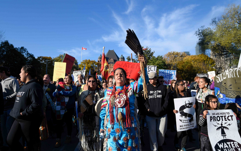 woman chanting slogans during a solidarity rally with the Pipeline protesters