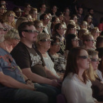 people watching theatre performance using smart glasses