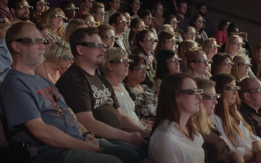 people watching theatre performance using smart glasses
