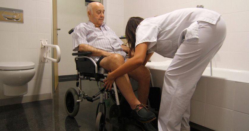Patients who have suffered a stroke perform recovery activities with the help of nurses in the recovery program at Hospital