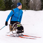 athlete skier with disability training outdoors in winter