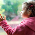 Girl looking out of the window