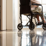 Disabled Woman Sitting In Wheelchair
