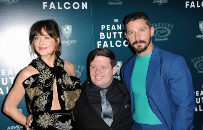 Dakota Johnson, Zack Gottsagen and Shia LaBeouf at the Los Angeles premiere of `The Peanut Butter Falcon`