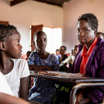 a girl in the classroom looking at camera
