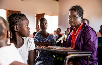 a girl in the classroom looking at camera