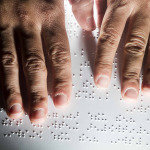 blind person reading braille
