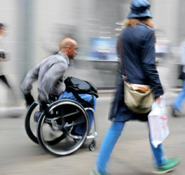 blurred movement disabled man on a city street