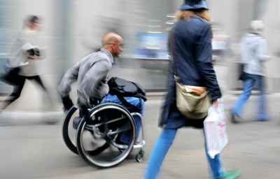 blurred movement disabled man on a city street