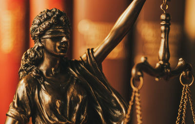 Blindfolded justice holding up the scales