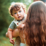 woman with her baby boy on a summer sunny day