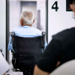 Patient elderly sitting on wheelchair while waiting a doctor to treat
