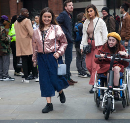 women outside with a women in wheelchair