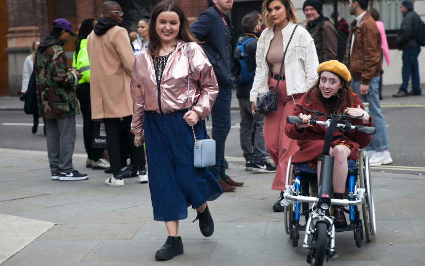 women outside with a women in wheelchair