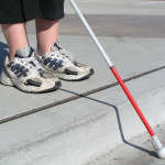 A blind person crossing the street