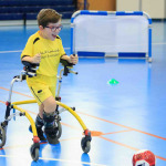 a kid with disability playing football