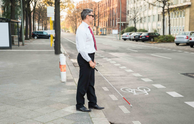 Blind Man Crossing Road Holding white cane