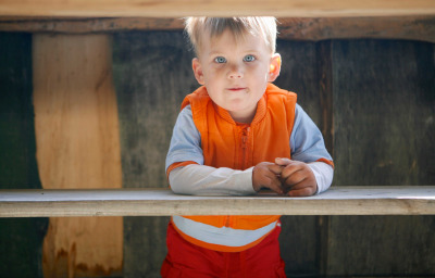 boy with autism under table