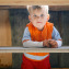 boy with autism under table