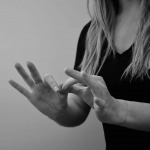 Woman interpreting American Sign Language