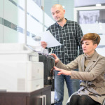 Woman in wheelchair working in the office