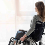 Portrait of women in wheelchair looking away