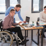Group of adult men working together at the office