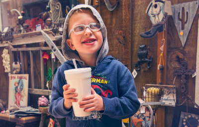 kid with autism with big drink