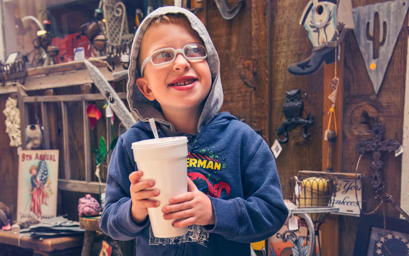kid with autism with big drink