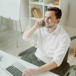 Businessman in wheelchair at work