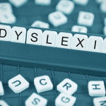 Dyslexia concept with game board and random letters