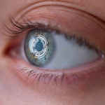 Woman's eye with lens with digital and biometric implants