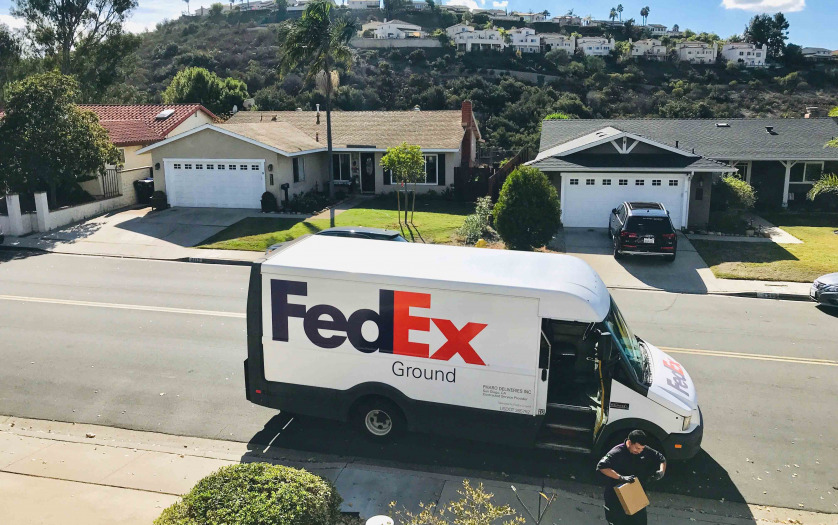 FedEx making a ground delivery in a San Diego neighborhood