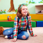 girl with disability smiling