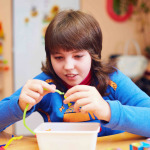 with disability develops fine motor skills at rehabilitation center