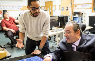 Martez Mott, left, a PhD candidate in the University of Washington’s Information School, works on Smart Touch technology with Ken Frye at Provail